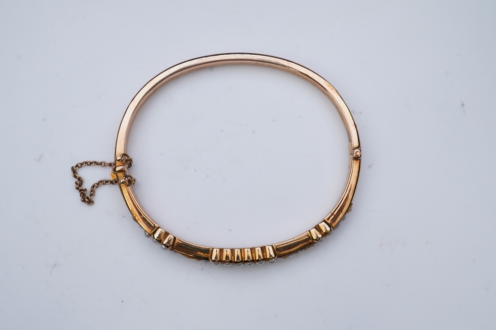 An Edwardian seed pearl bangle, early 20th century